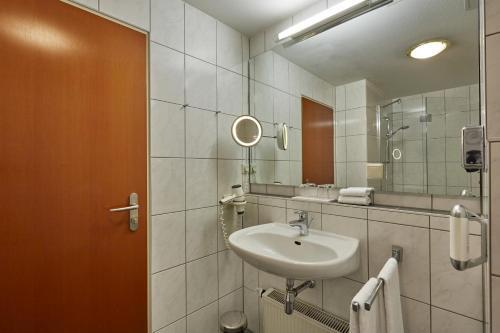 Foto del baño de H+ Hotel Darmstadt