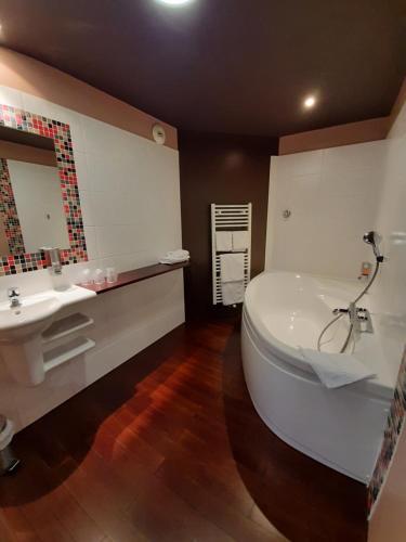 Foto del baño de Hotel La Corniche