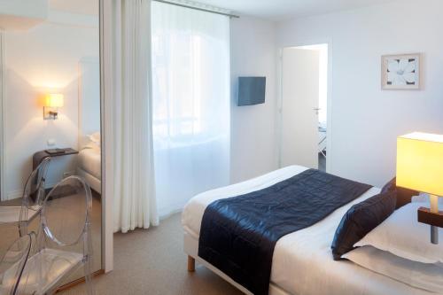 Foto de una habitación de Hôtel La Marine