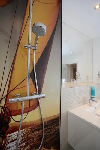 Foto del baño de ApartHotel Victoria am See