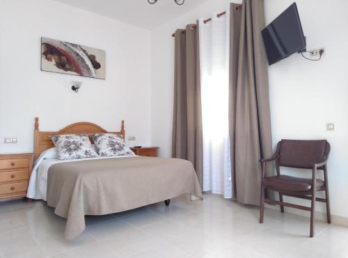 Foto de una habitación de Hostal Los Arcos