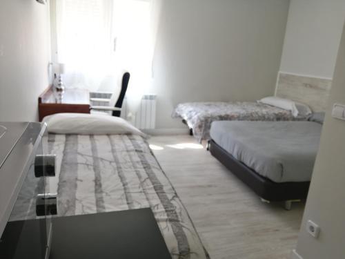 Foto de una habitación de Aparthotel Estudios los Arcos