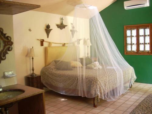 Foto de una habitación de Hotel Macan Ché B&amp;amp;B