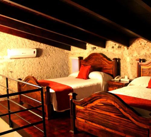 Foto de una habitación de Hotel Boutique Casabella