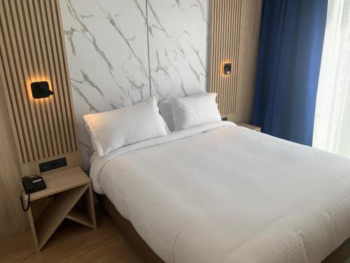 Foto de una habitación de Rihab Hotel