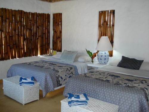 Foto de una habitación de Junto al Rio Bungalows &amp;amp; Suites