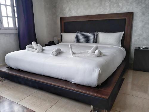 Foto de una habitación de AMWAJ HOTEL