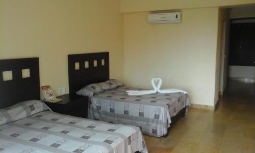 Foto de una habitación de Hotel RRU Diamante