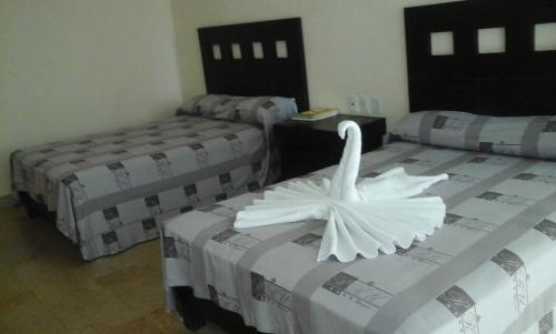 Foto de una habitación de Hotel RRU Diamante