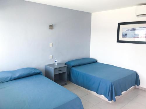 Foto de una habitación de Hotel Mona Inn