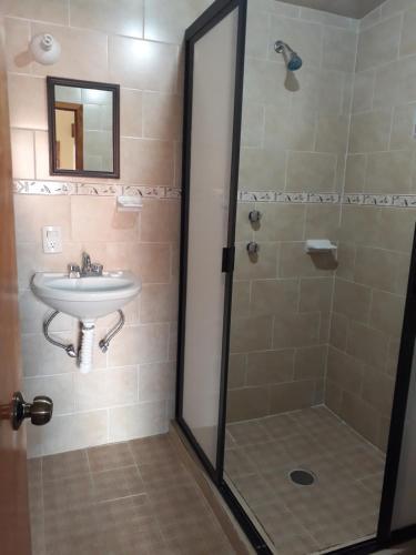 Foto del baño de Hotel Tres Flores