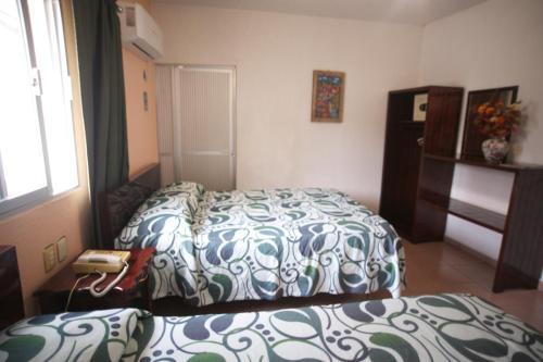 Foto de una habitación de Hotel Maria De Lourdes