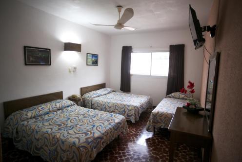 Foto de una habitación de Hotel Maria De Lourdes