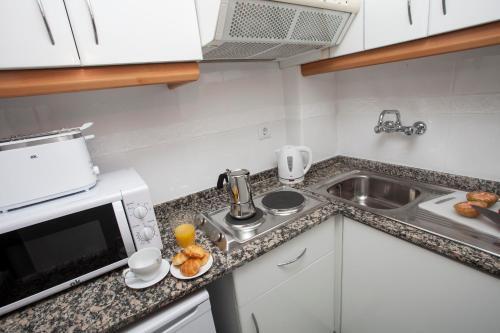 Foto de una habitación de Apartamentos SingularStays Mercado Central