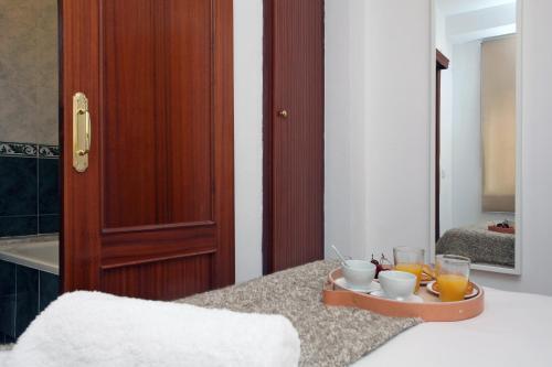 Foto de una habitación de Apartamentos SingularStays Mercado Central