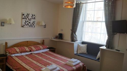 Foto de una habitación de Hampton Court Guesthouse