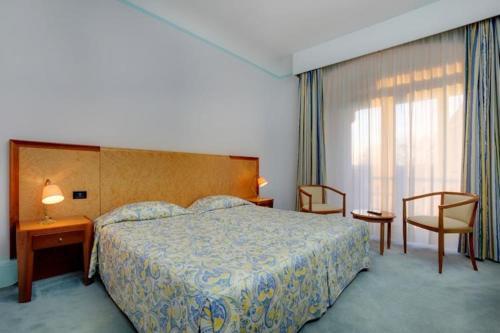 Foto de una habitación de Hôtel Aletti Palace