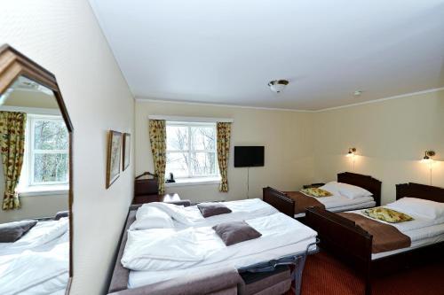 Foto de una habitación de Kronen Gaard Hotel