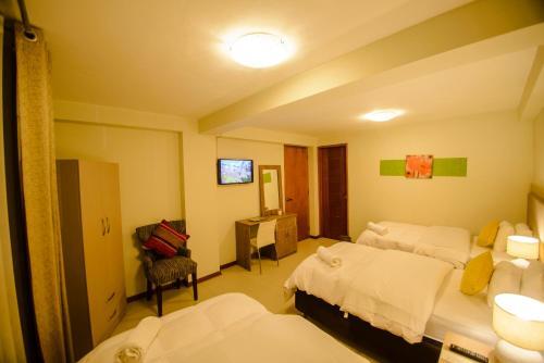 Foto de una habitación de Hotel Wayta Inn