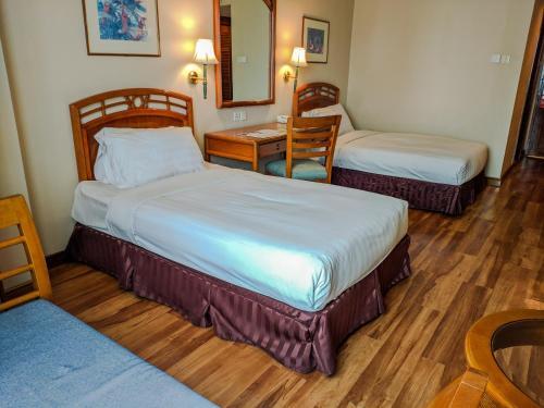 Foto de una habitación de Sabah Oriental Hotel