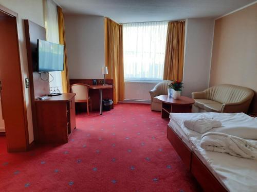 Foto de una habitación de AVALON Hotelpark Königshof