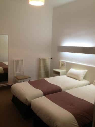 Foto de una habitación de Hôtel Mondial