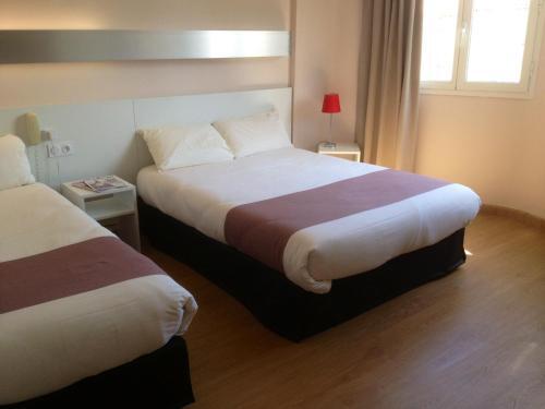 Foto de una habitación de Hôtel Mondial