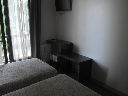 Foto de una habitación de Acqs Hôtel
