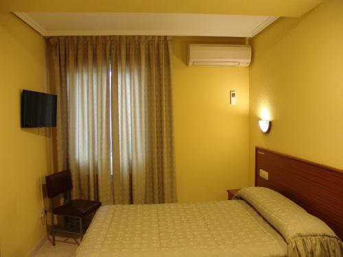 Foto de una habitación de Hostal Athlanta