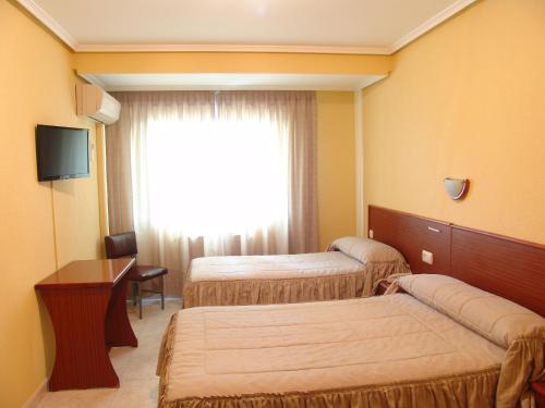 Foto de una habitación de Hostal Athlanta