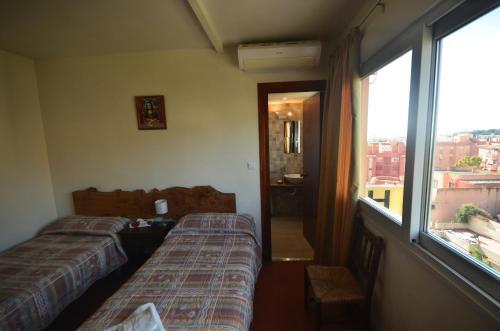 Foto de una habitación de Hostal La Palmera