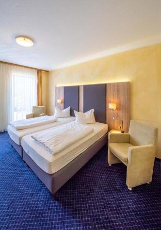Foto de una habitación de Stadthotel Pfeffermühle