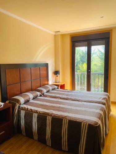 Foto de una habitación de Hotel AV Apartamentos Lobios