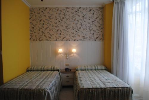 Foto de una habitación de Hostal Santa Marta Playa