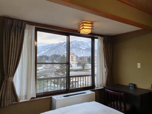 Foto de una habitación de Kokoro Hotel Hakuba