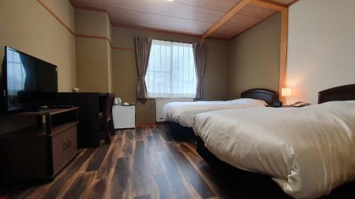 Foto de una habitación de Kokoro Hotel Hakuba