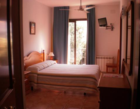 Foto de una habitación de Hotel Can Pepín