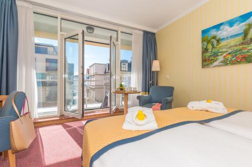 Foto de una habitación de Strand-Hotel Hübner