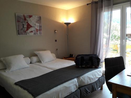 Foto de una habitación de Hotel Le Chabi