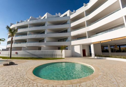 Foto de una habitación de Apartamentos Homity Exclusive Playa Granada Beach &amp;amp; Golf - Mar de Astrid