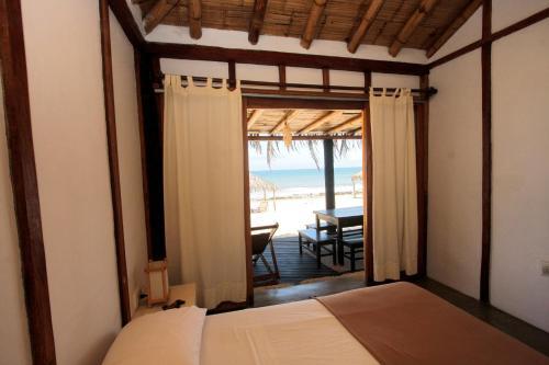Foto de una habitación de Hoja de Palma Bungalows