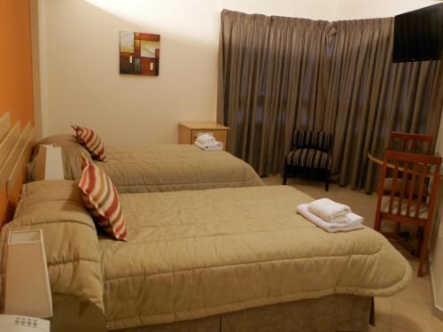Foto de una habitación de AVEMAR Apart Hotel