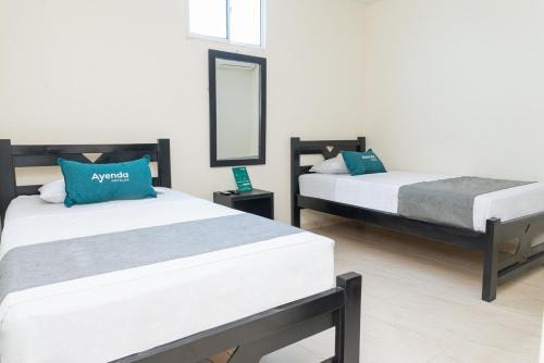 Foto de una habitación de Hotel Ayenda Itaka
