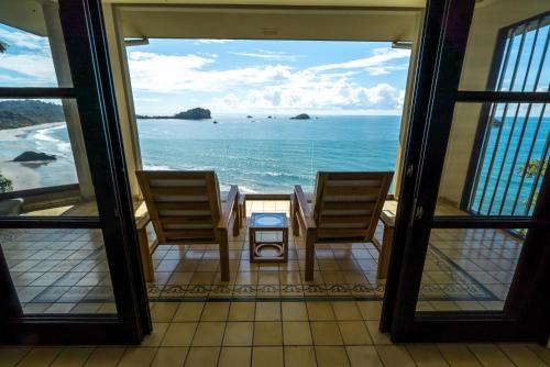 Foto de una habitación de Complejo Arenas Del Mar Beachfront &amp;amp; Rainforest Resort