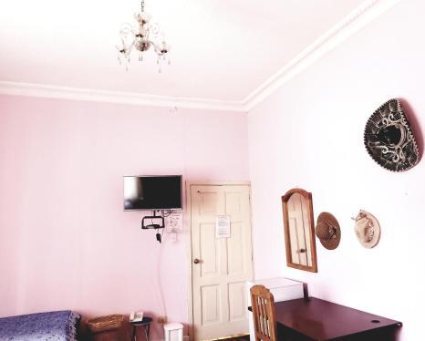 Foto de una habitación de Albergue Travellers Inn