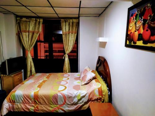 Foto de una habitación de Hostal Latitud Ecuem