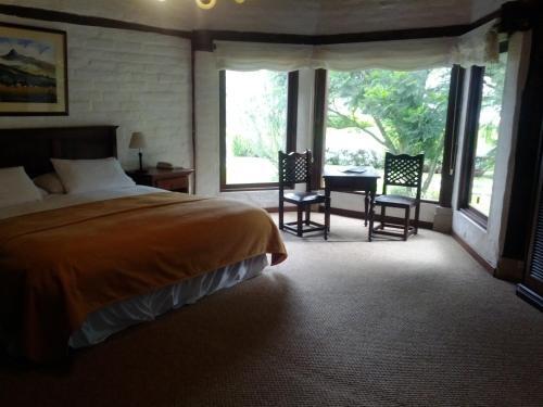 Foto de una habitación de Hotel Hacienda Abraspungo