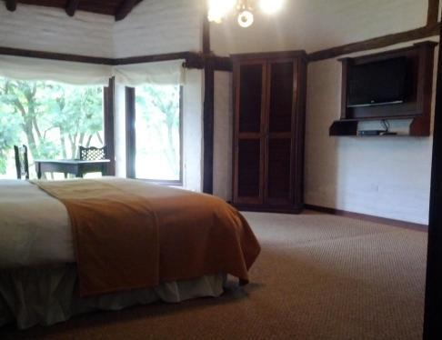Foto de una habitación de Hotel Hacienda Abraspungo