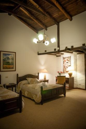 Foto de una habitación de Hotel Hacienda Abraspungo