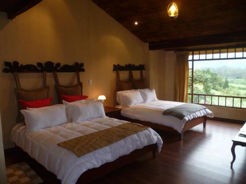 Foto de una habitación de Hotel Hacienda La Alegria